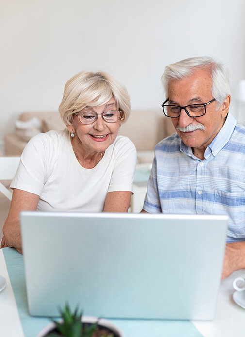 Seniors Looking at Laptop